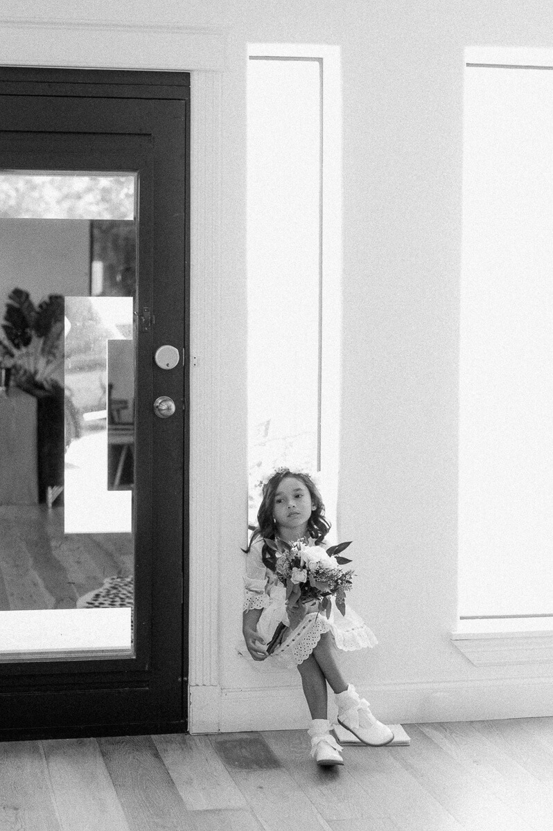 black and white photo of flower girl 