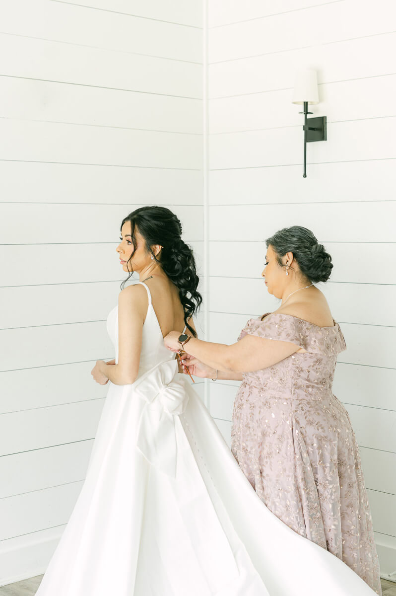 bride getting ready at the farmhouse in Montgomery 