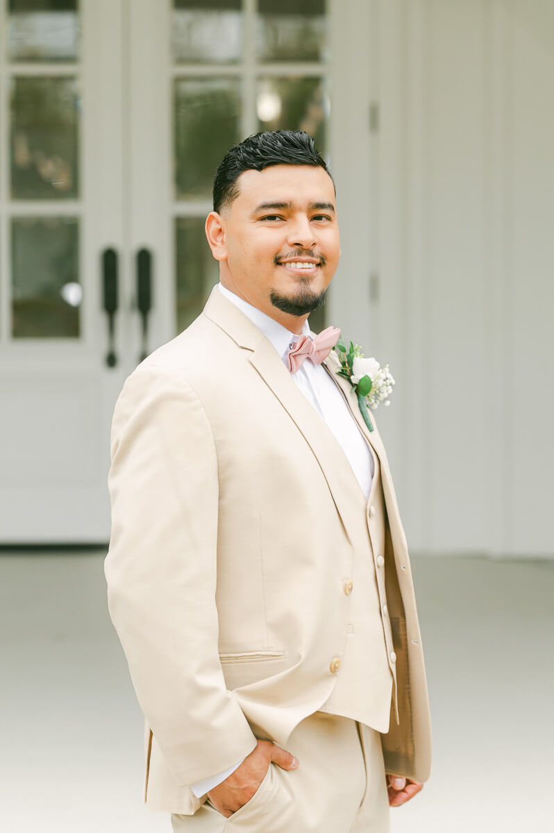 groom getting ready at the farmhouse wedding venue