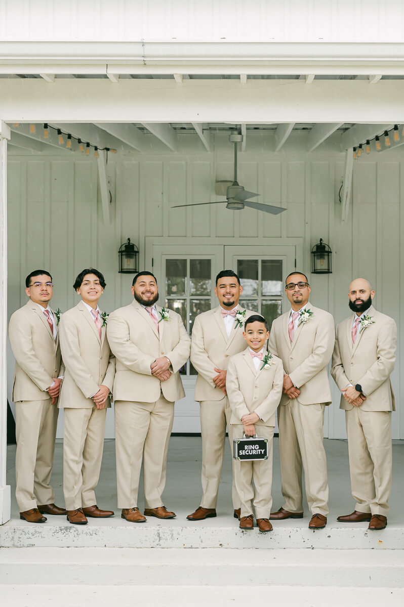 groomsmen portraits at the farmhouse wedding venue