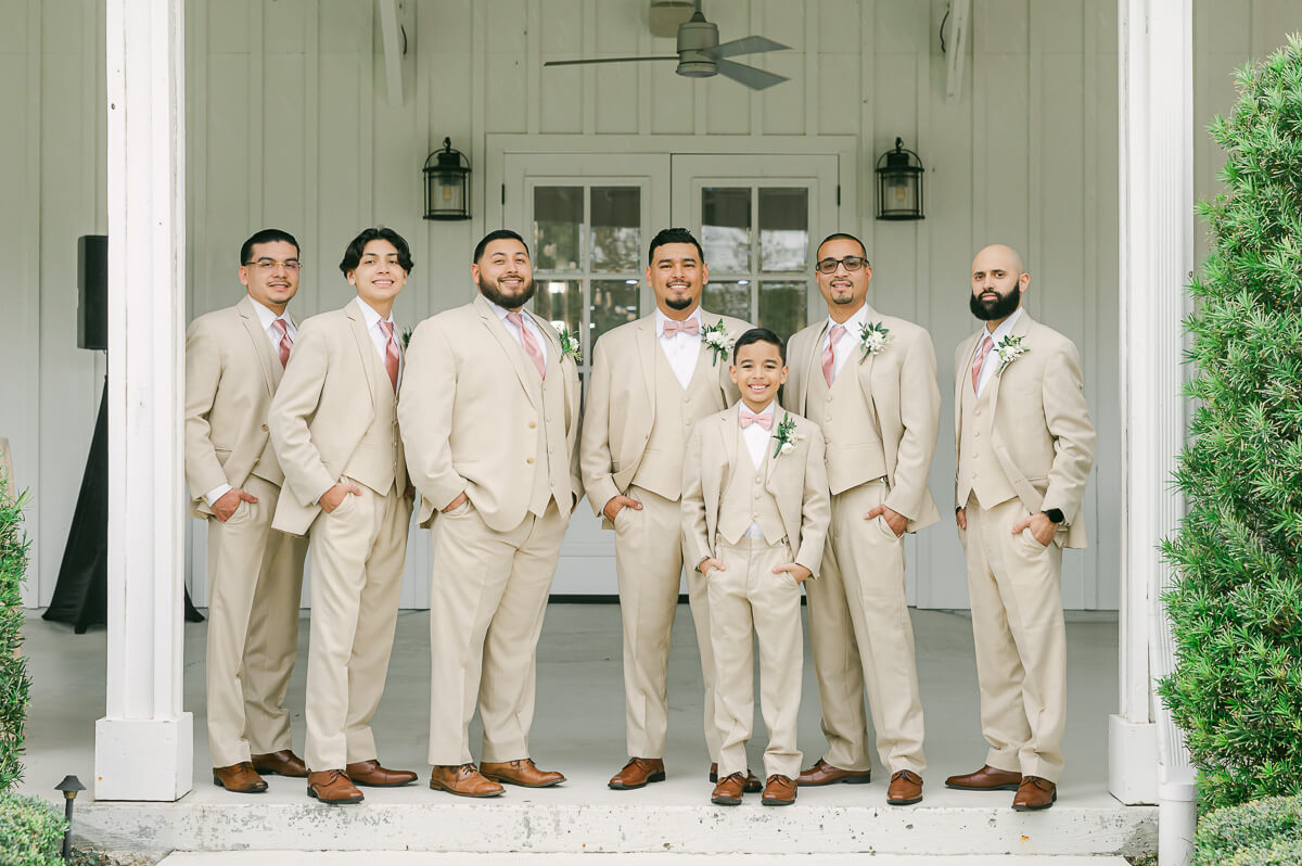 groomsmen portraits at the farmhouse wedding venue