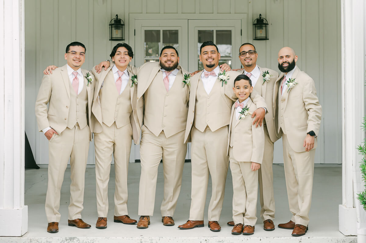 groomsmen portraits at the farmhouse wedding venue