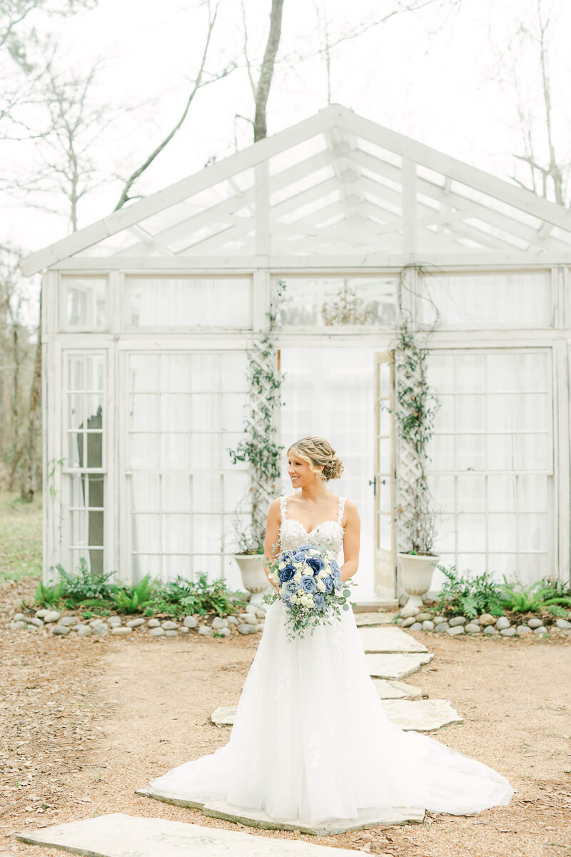 bride standing outside The Oak Atelier glass house