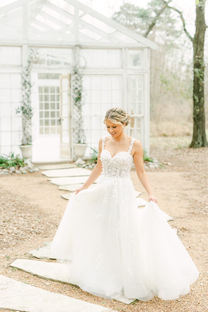 bride walking outside The Oak Atelier glass house