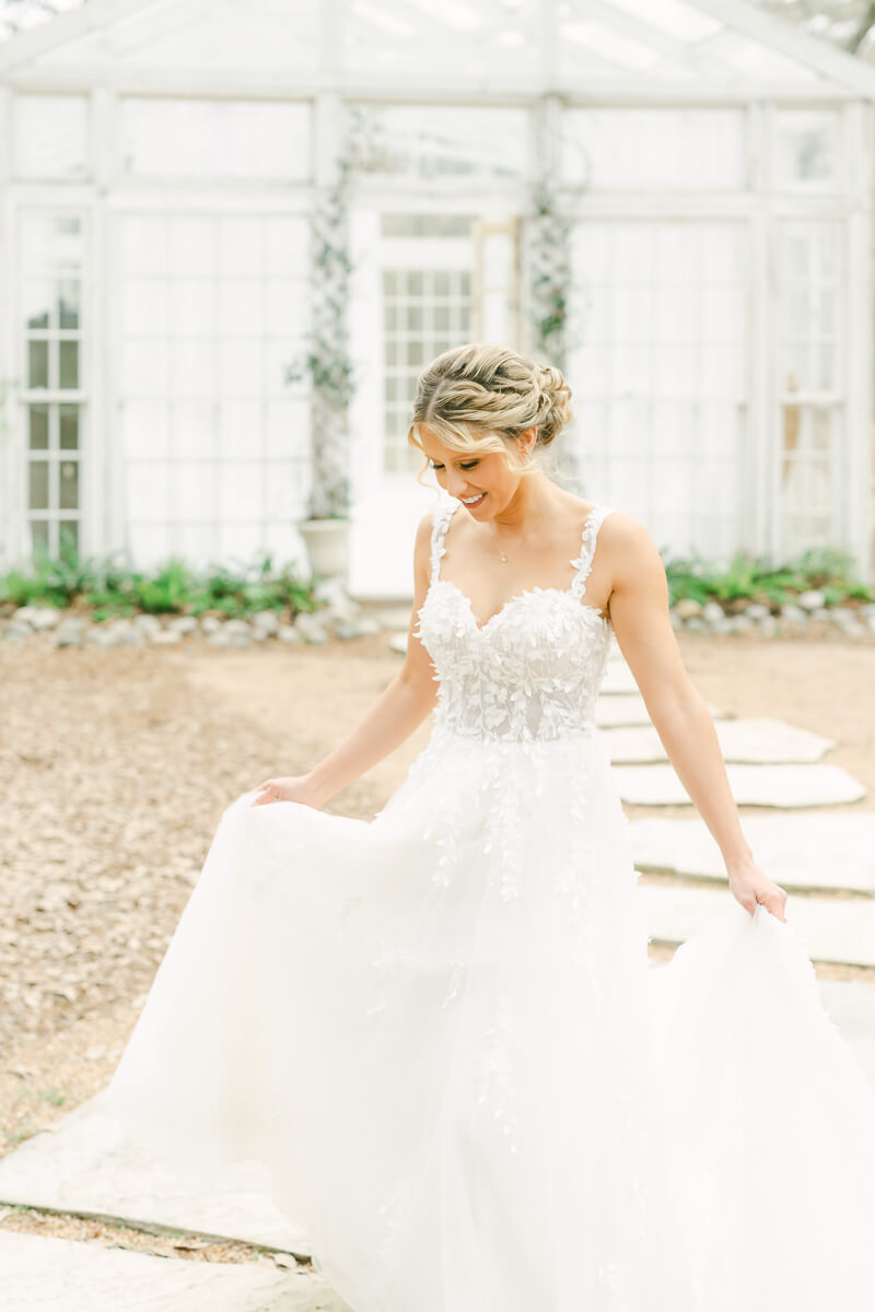 bride walking outside The Oak Atelier glass house