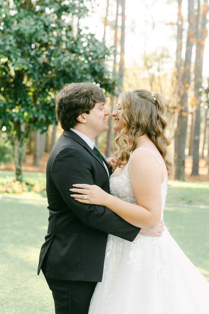 bride and groom posing for magnolia, tx wedding photographer