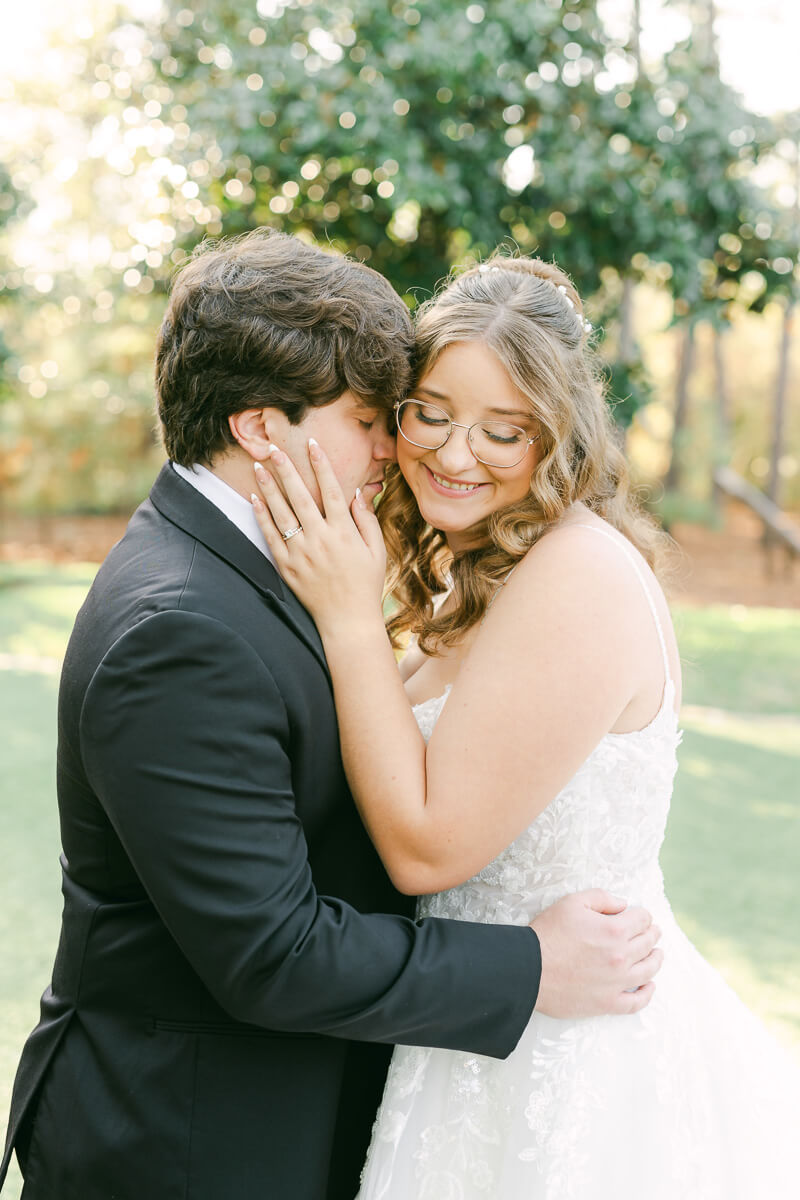 bride and groom posing for magnolia, tx wedding photographer