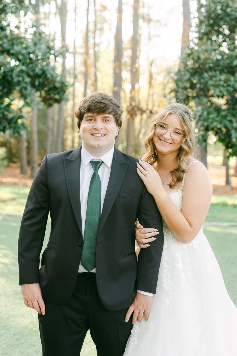 bride and groom posing for magnolia, tx wedding photographer