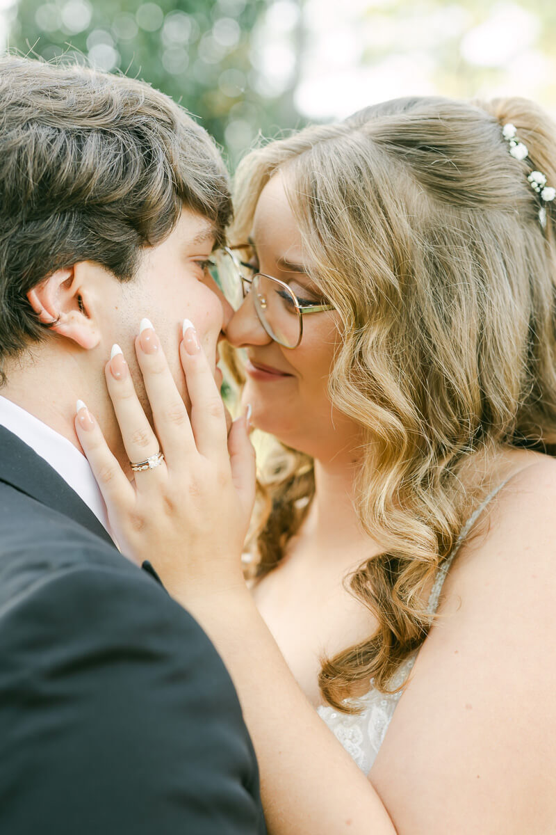 bride and groom posing for magnolia, tx wedding photographer