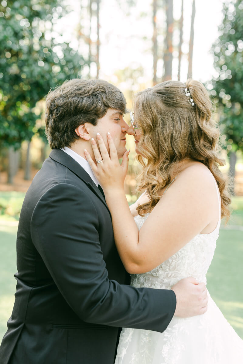 bride and groom posing for magnolia, tx wedding photographer