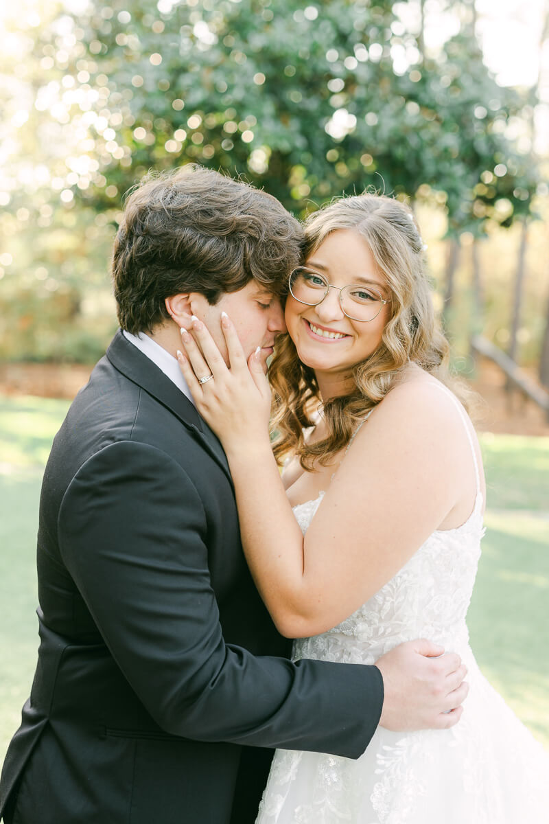 bride and groom posing for magnolia, tx wedding photographer