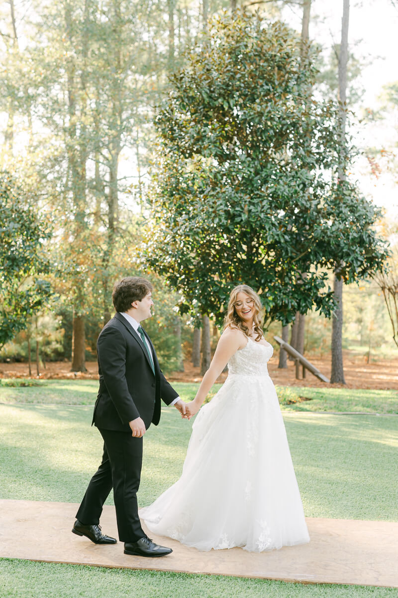 couple walking at the springs magnolia