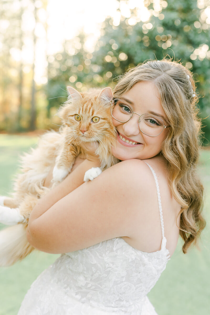 a bride posing with a cat