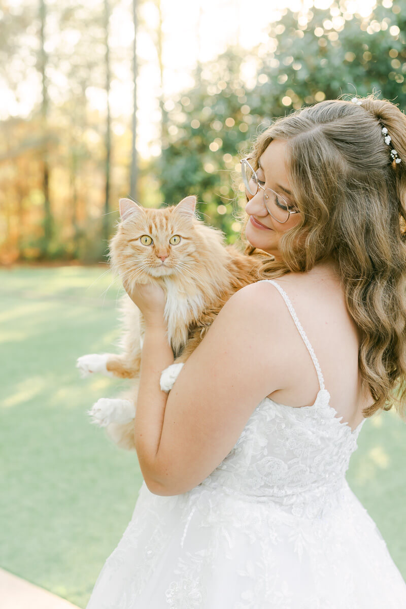 a bride posing with a cat