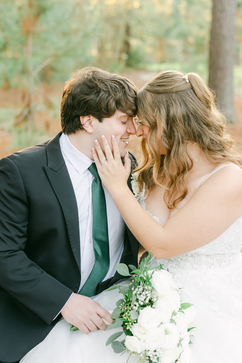 bride and groom posing for Houston wedding photographer 