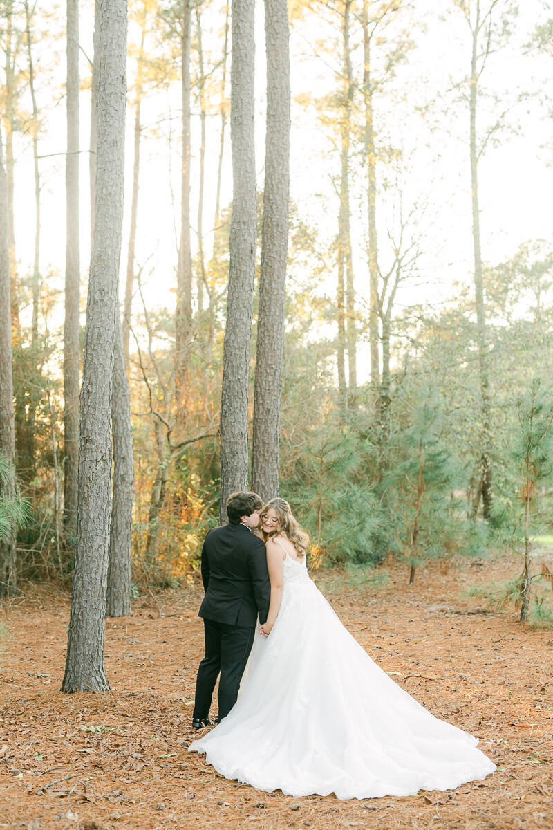 bride and groom posing for Houston wedding photographer 