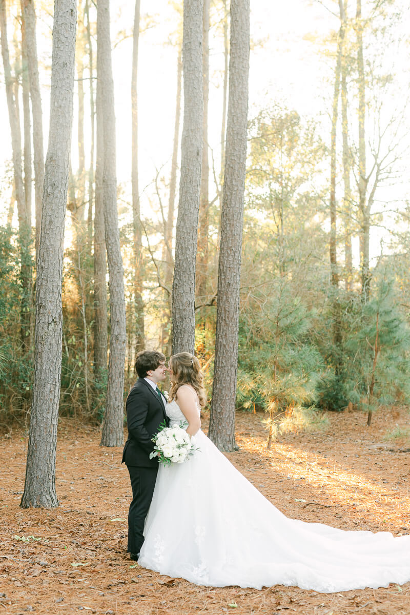 bride and groom posing for Houston wedding photographer 