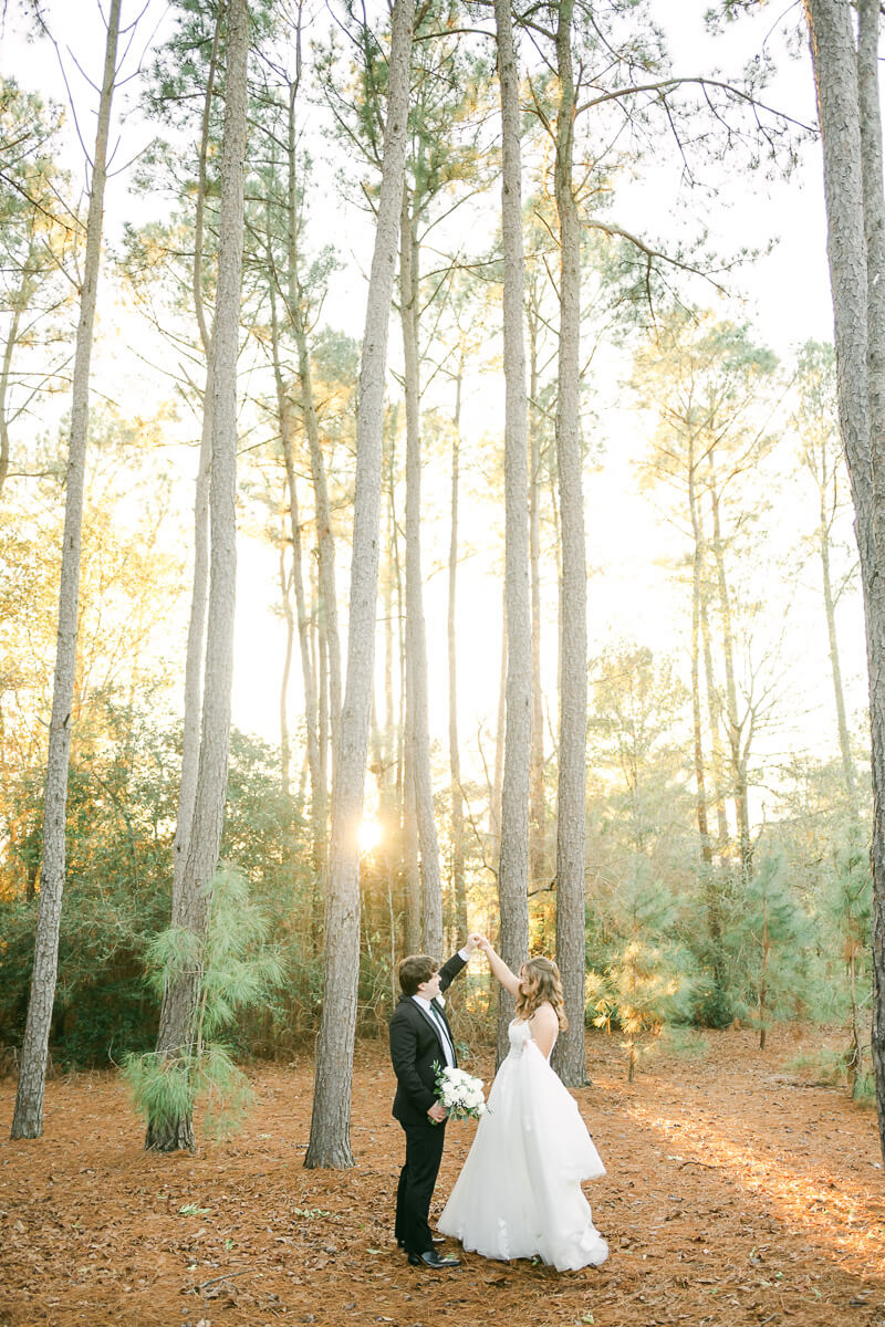 bride and groom posing for Magnolia, Tx wedding photographer 