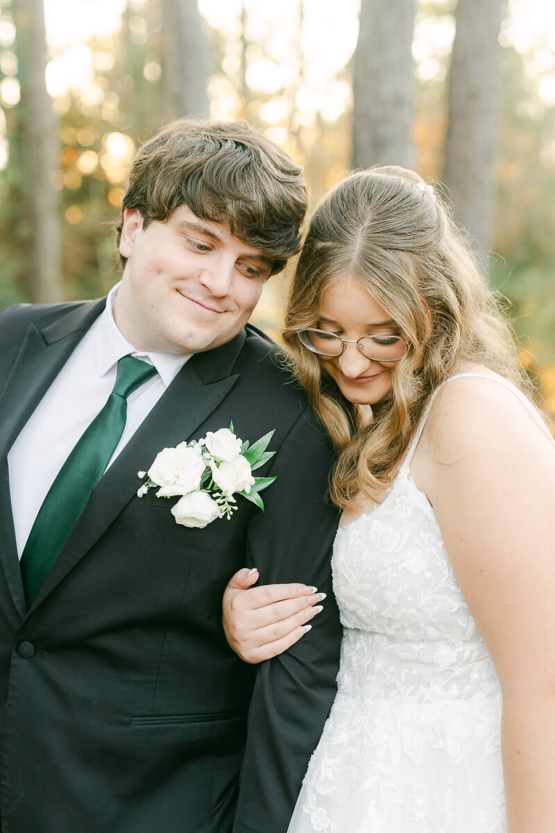 bride and groom posing for Magnolia, Tx wedding photographer 