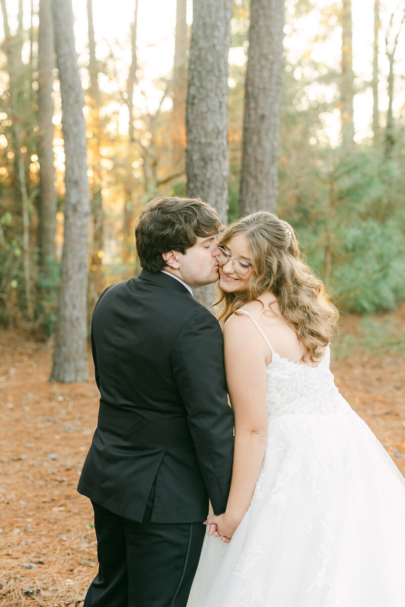 bride and groom posing for Magnolia, Tx wedding photographer 