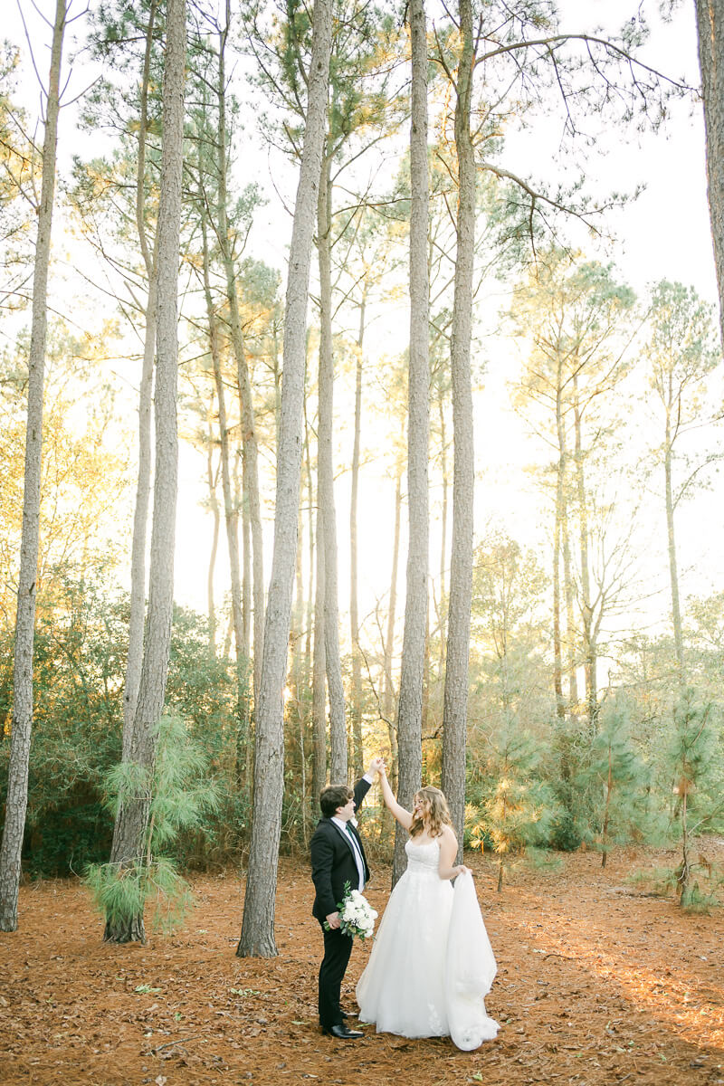 bride and groom posing for Magnolia, Tx wedding photographer 