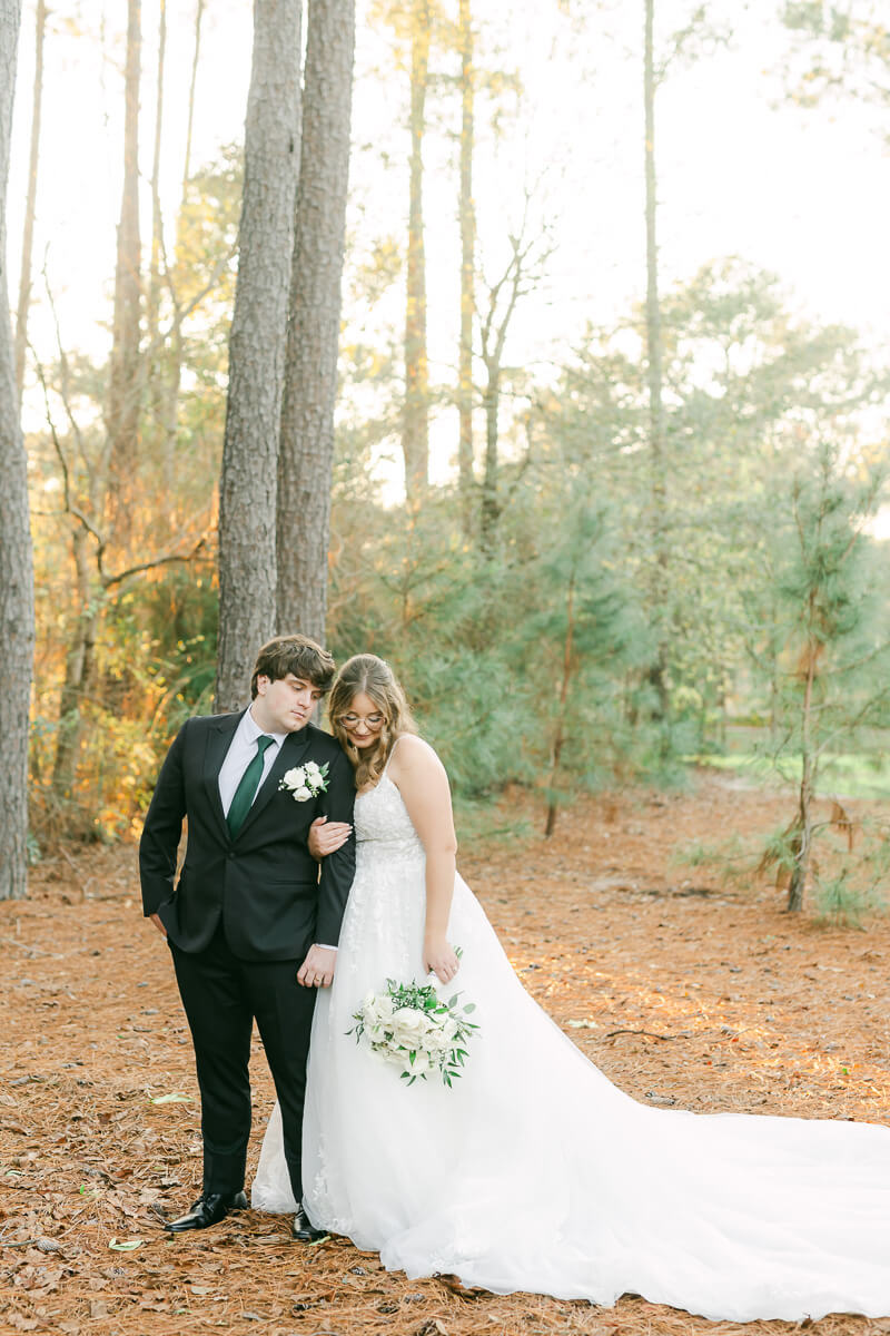 bride and groom posing for Magnolia, Tx wedding photographer 