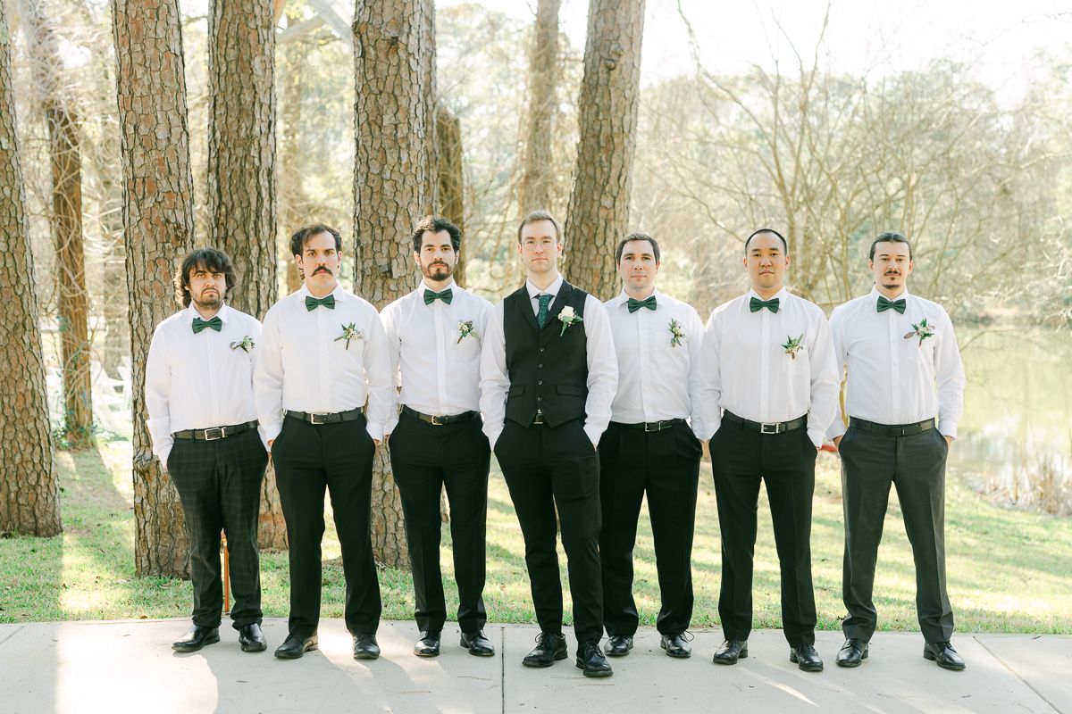 wedding party wearing black with green ties