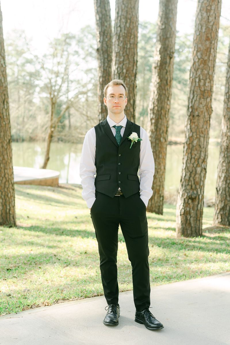 groom wearing black with green tie at Forever 5 Events
