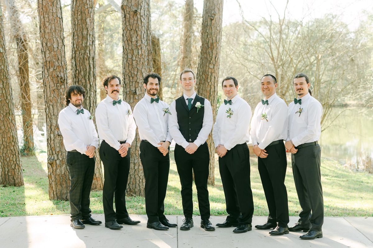 wedding party wearing black with green ties