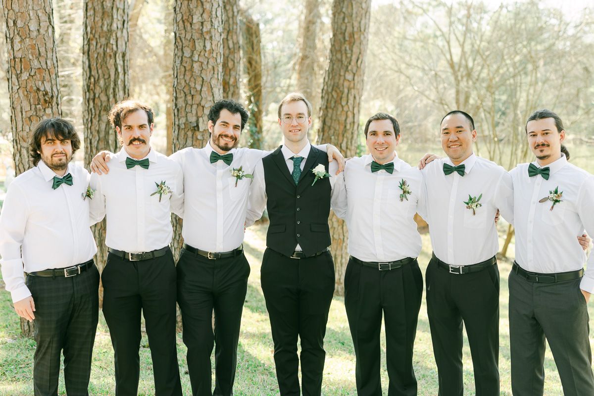 wedding party wearing black with green ties