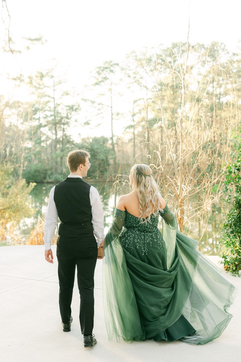 bride and groom walking near lake at Forever 5 Events