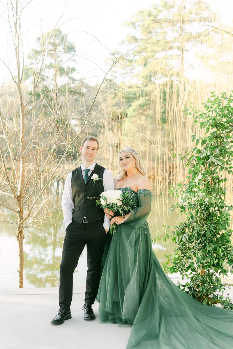 groom with bride wearing emerald green wedding dress