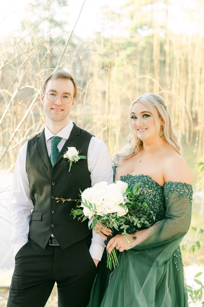 groom with bride wearing emerald green wedding dress