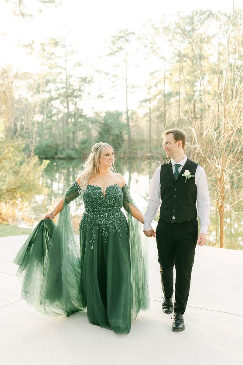 bride and groom walking near lake at Forever 5 Events