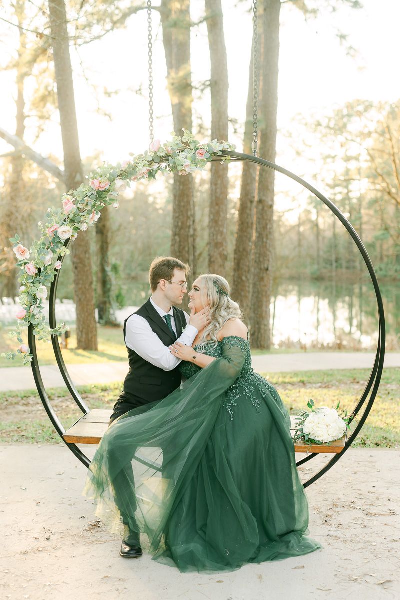 bride and groom sitting on the swing at Forever 5 Events