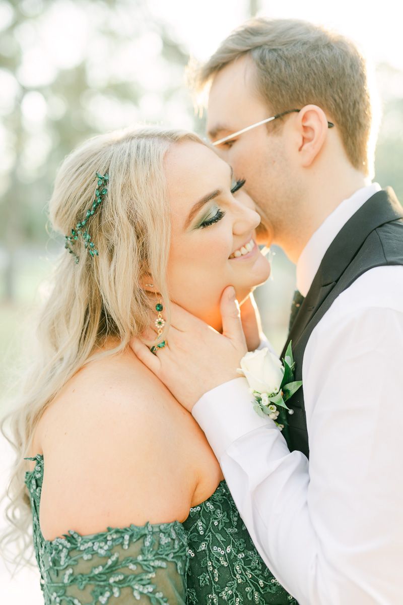 groom whispering in bride's ear