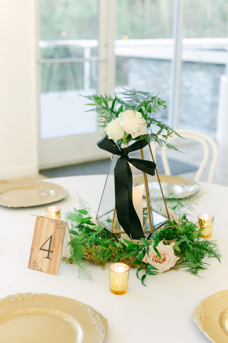 candles and flowers on table at wedding reception