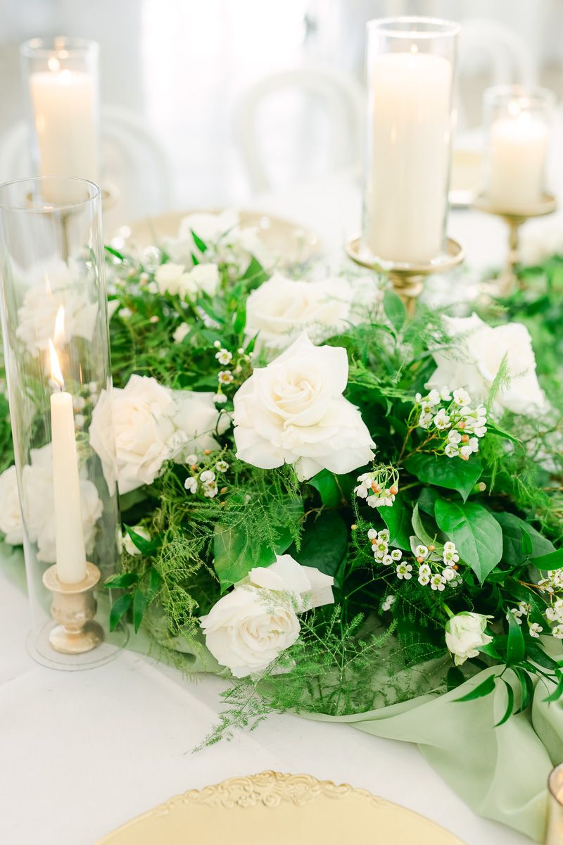 candles and flowers on table at wedding reception