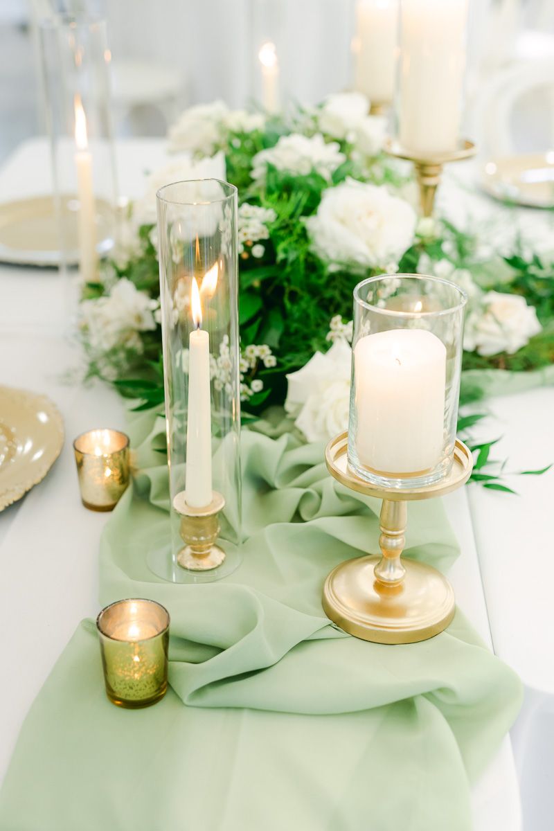 candles and flowers on table at wedding reception