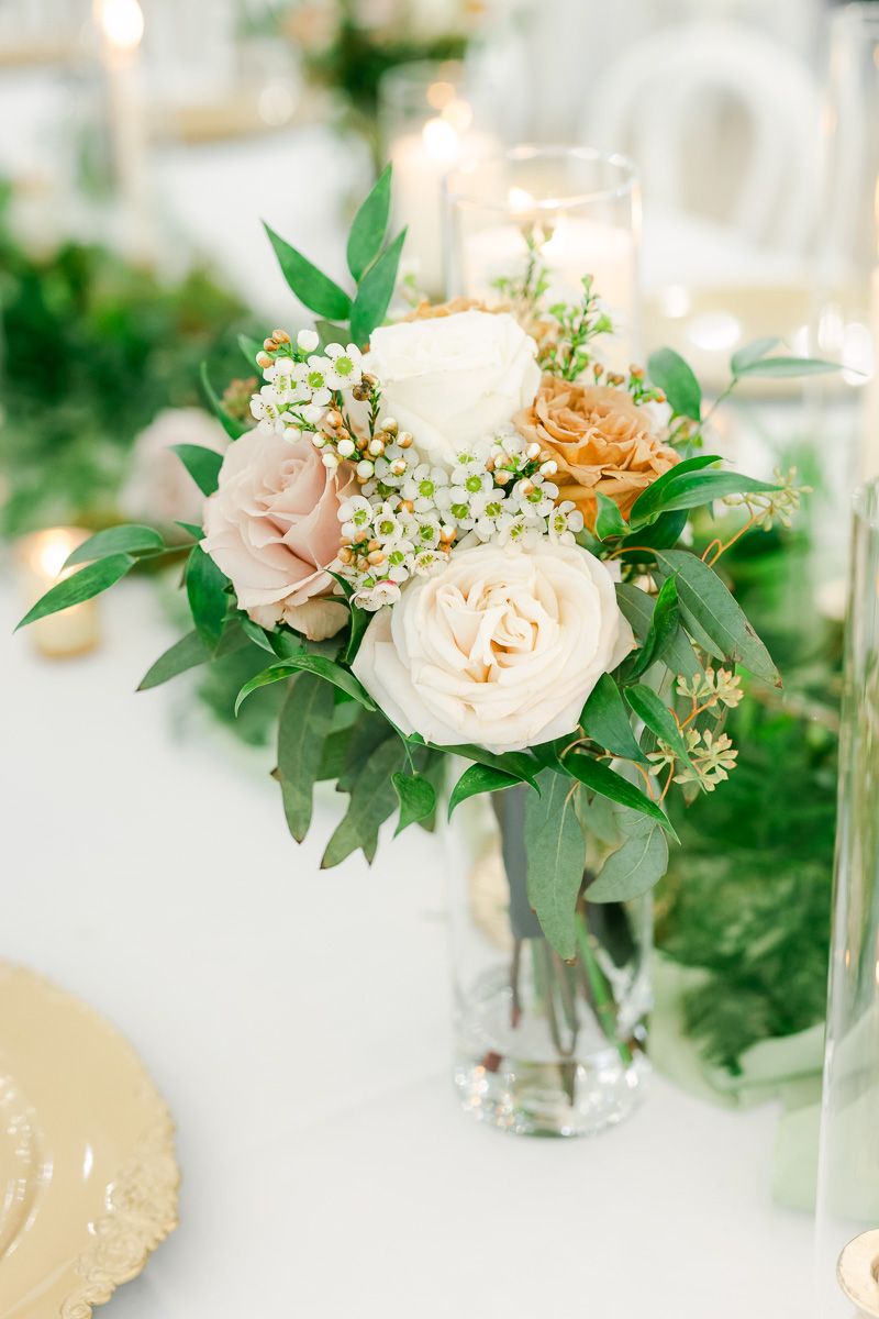candles and flowers on table at wedding reception