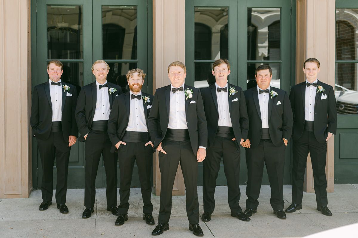 groomsmen outside Galveston wedding venue