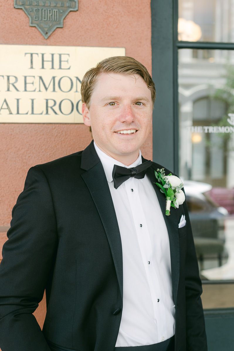 groom outside Galveston wedding venue