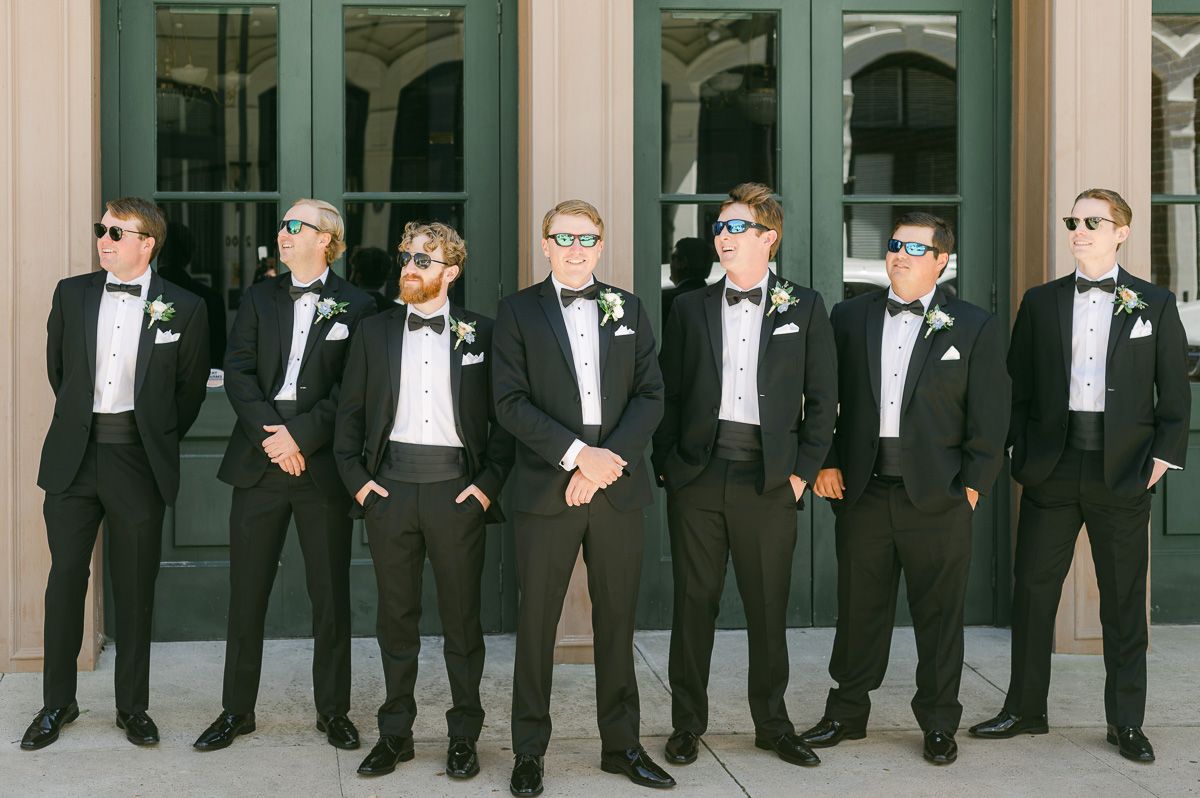 groomsmen outside Galveston wedding venue