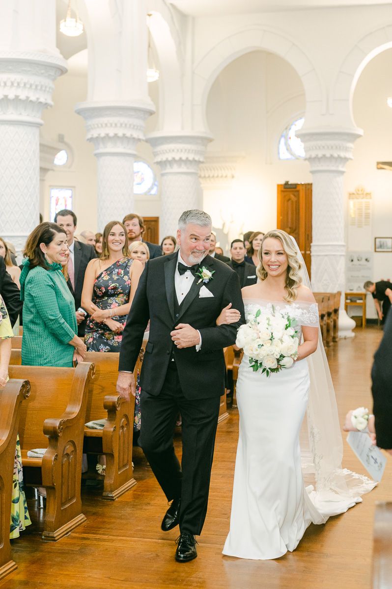 bride and her father walking down the aisle