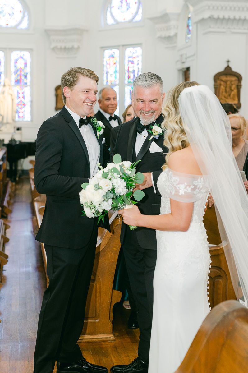 father of the bride giving the bride away
