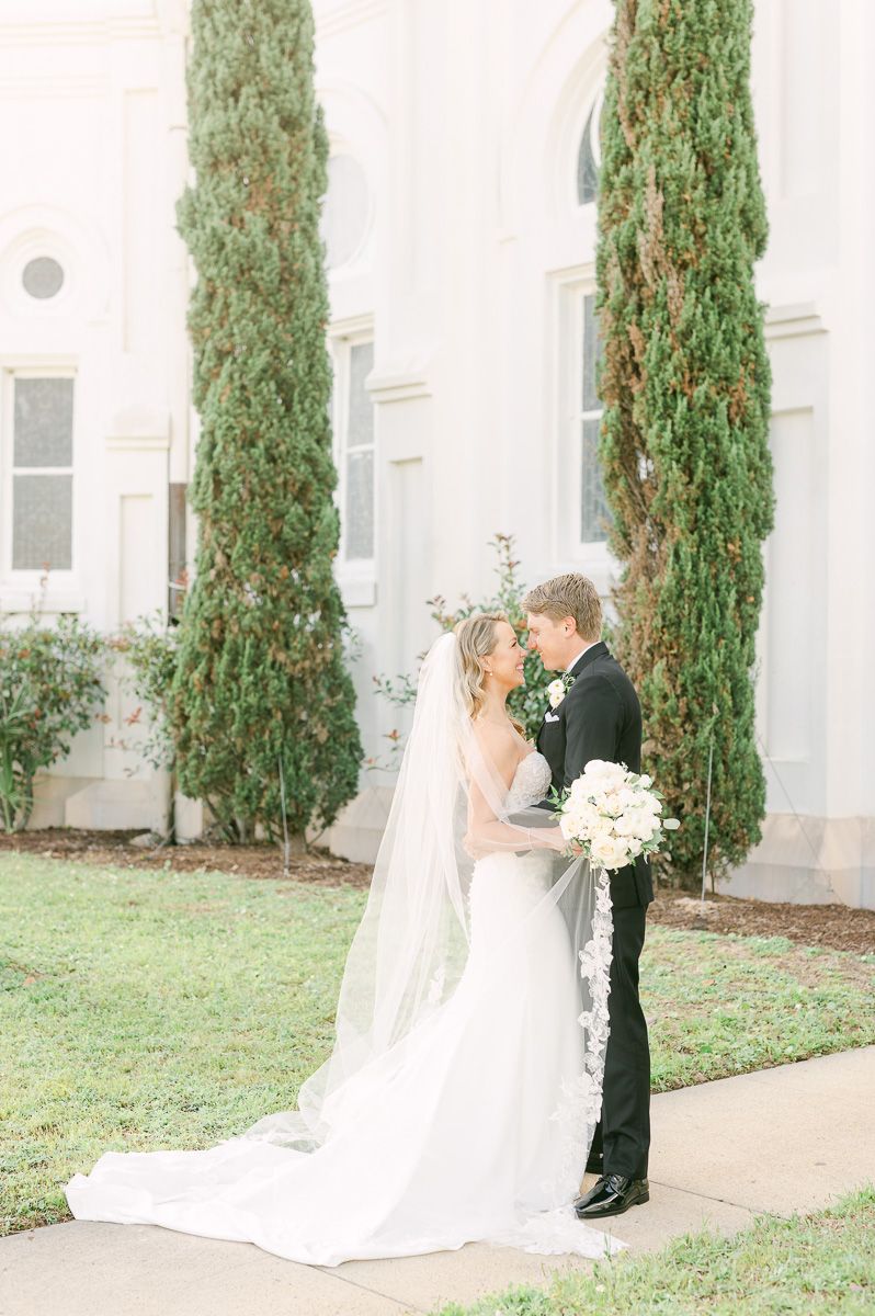 bride and groom outside Galveston wedding venue