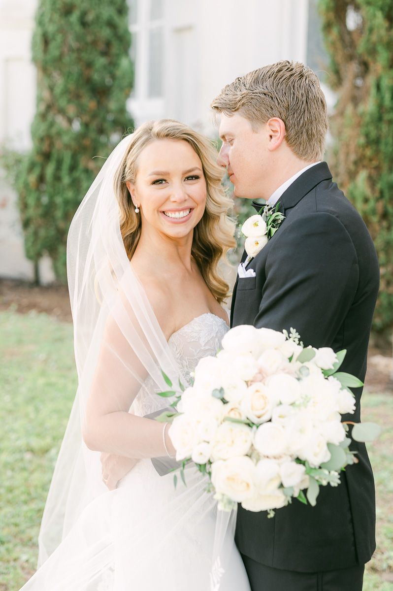 bride and groom outside Galveston wedding venue