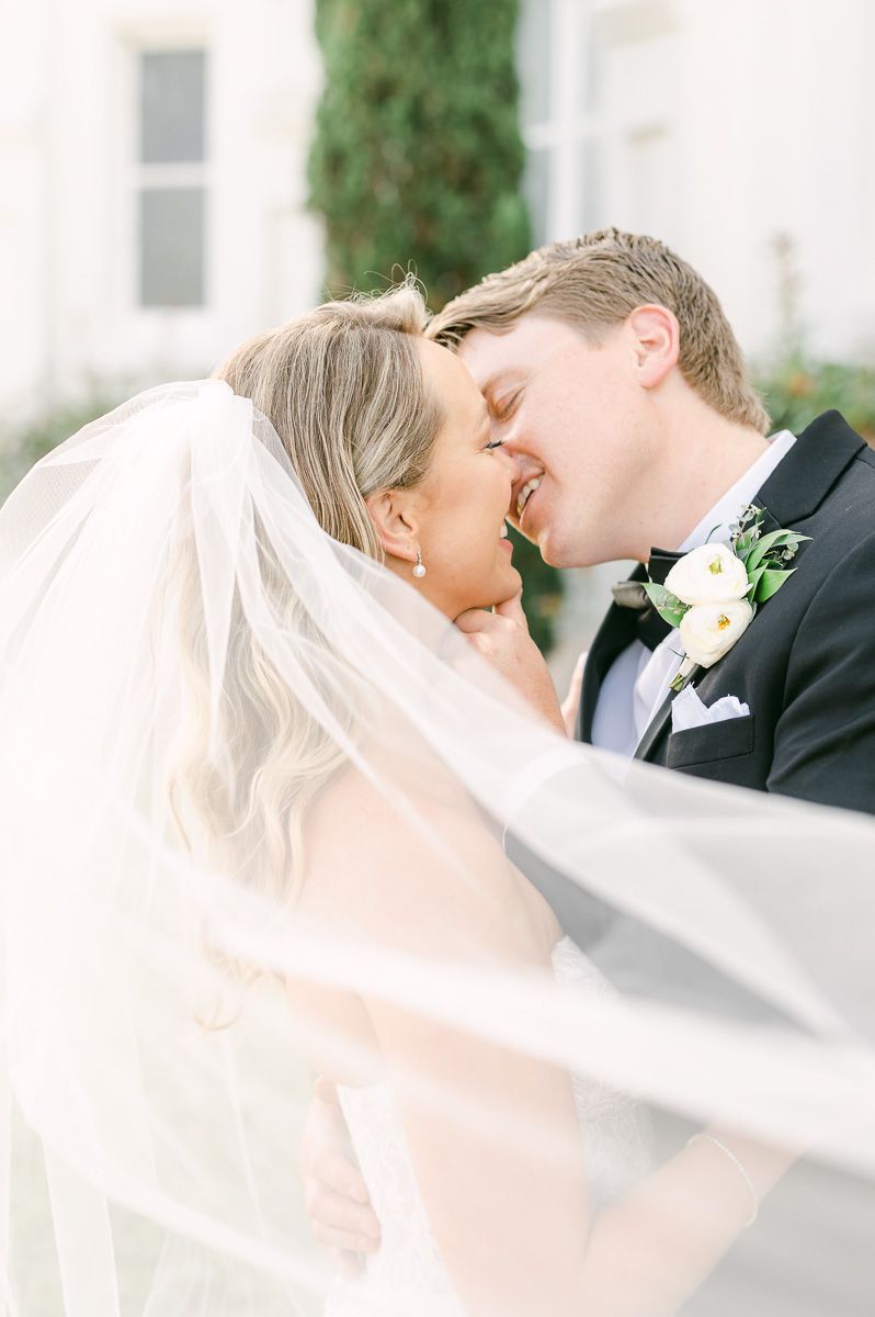 bride and groom outside Galveston wedding venue