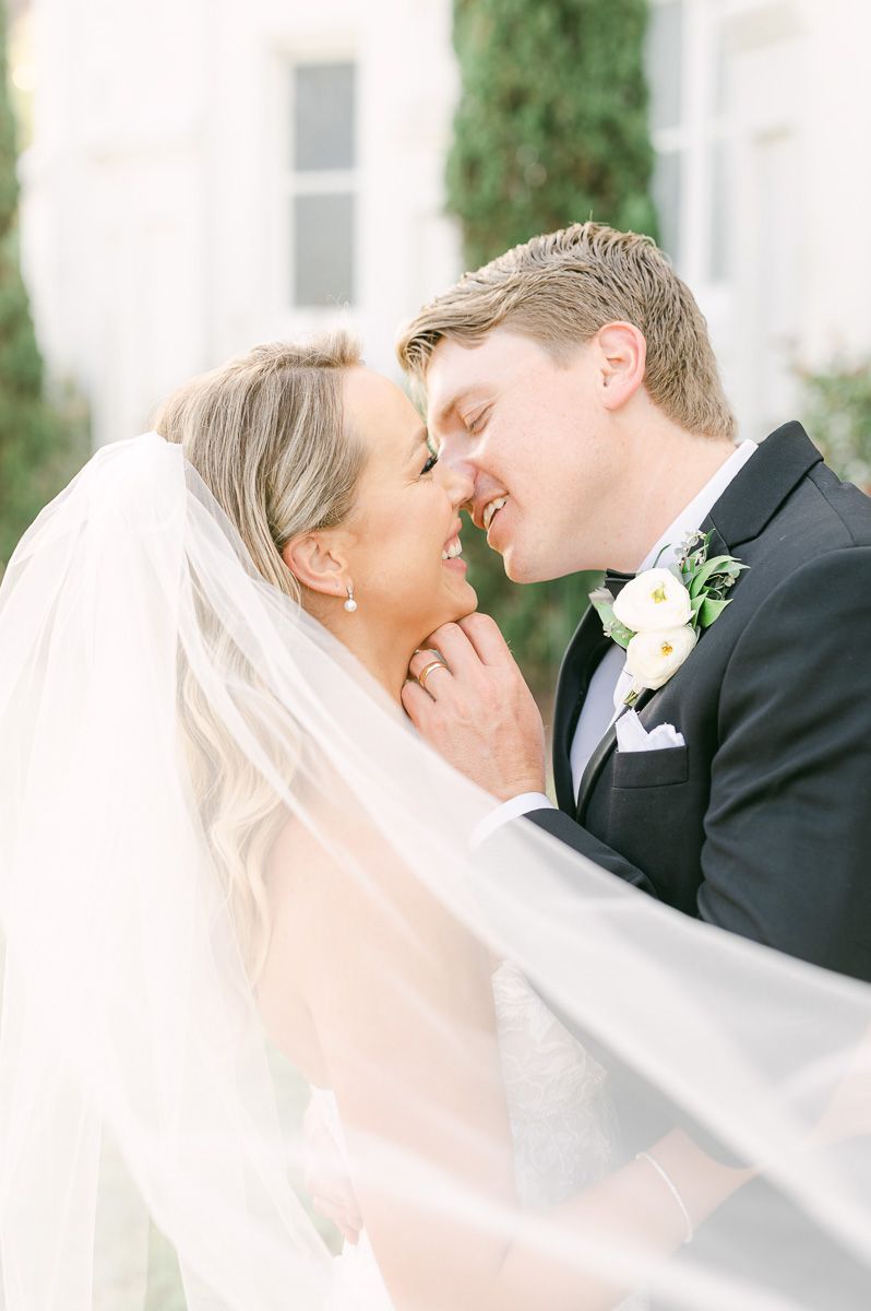 bride and groom with veil flowing