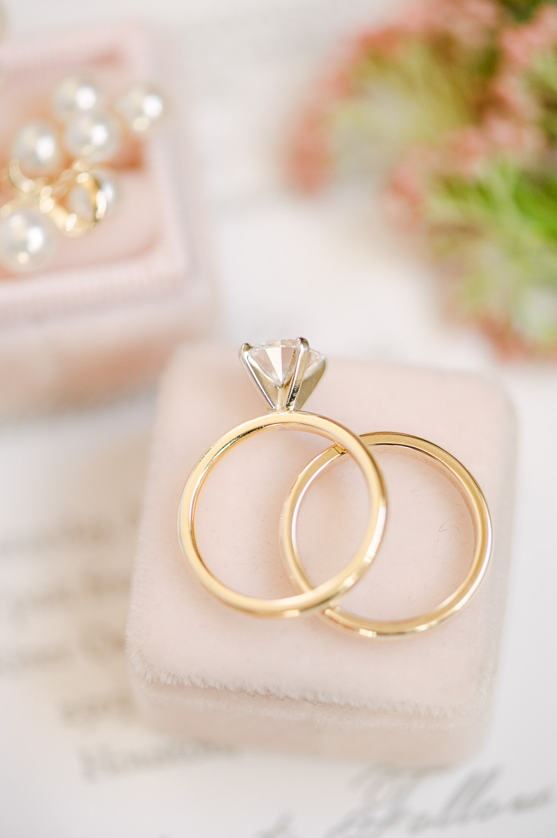 wedding rings on pink ring box